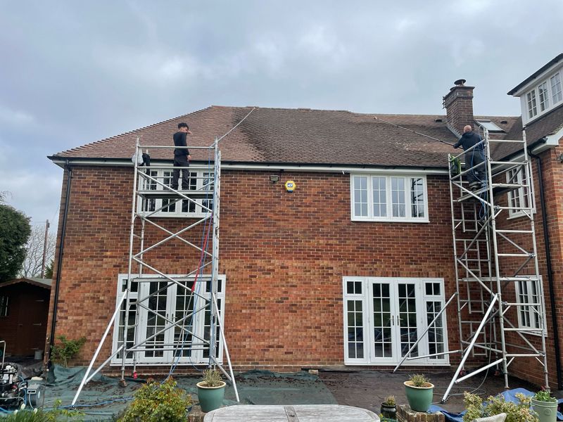 Roof cleaning carried out safely from scaffold towers by The Roof Moss Cleaners in Melbourn